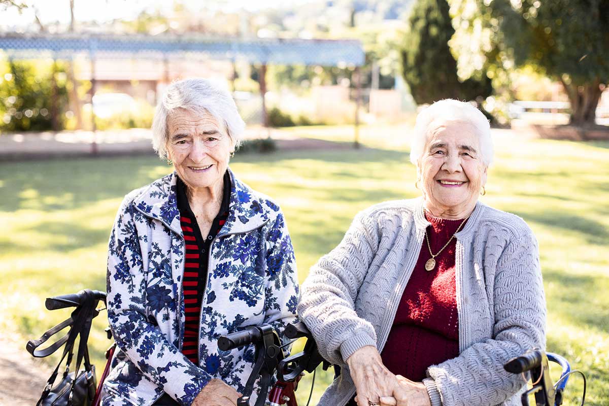 Two clients relaxing in the garden