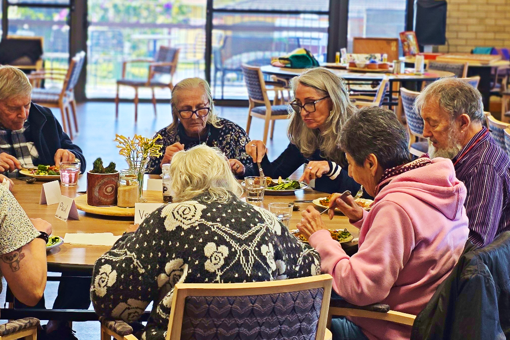 A worker with some clients at day club